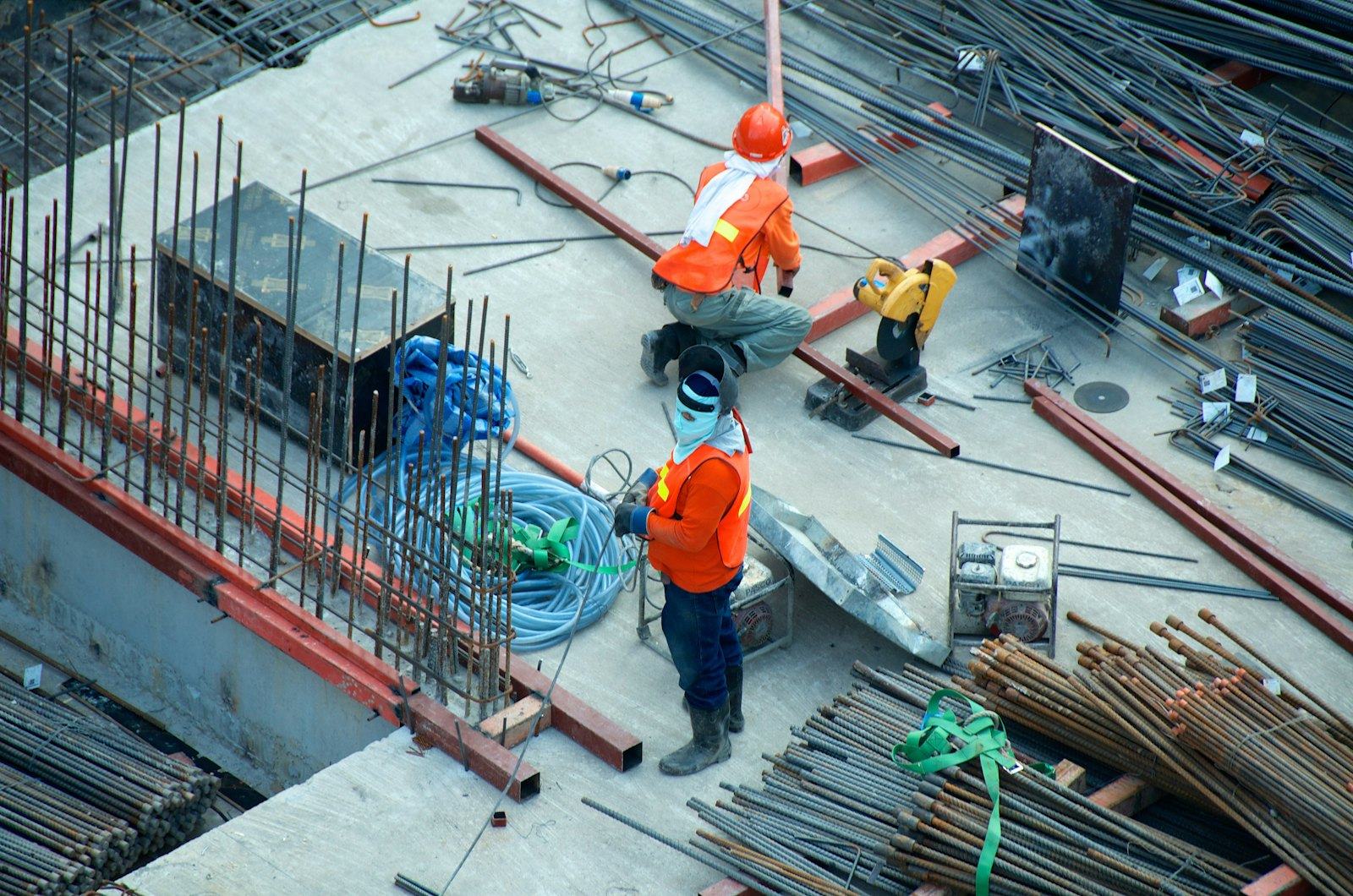Supervised construction team working together on site